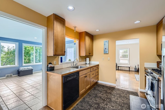 12019B 25th Ave NE, Seattle, WA 98125 - kitchen with dishwasher, gas stove, healthy amount of natural light, a sink, and recessed lighting