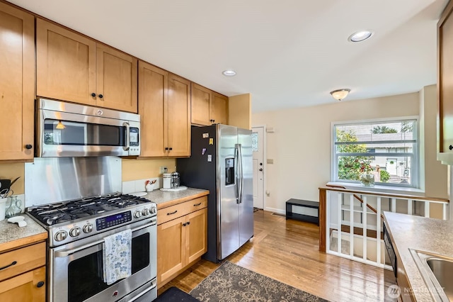 12019B 25th Ave NE, Seattle, WA 98125 - kitchen featuring stainless steel appliances, dark wood finished floors, light countertops, recessed lighting, and baseboards