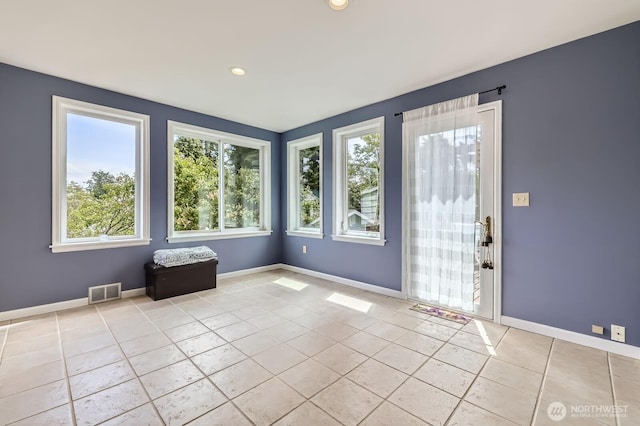 12019B 25th Ave NE, Seattle, WA 98125 - unfurnished room with healthy amount of natural light, light tile patterned floors, baseboards, and recessed lighting
