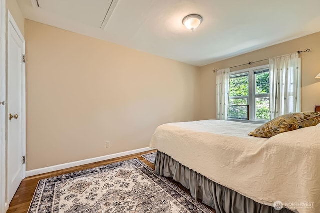 12019B 25th Ave NE, Seattle, WA 98125 - bedroom featuring baseboards and dark wood-style floors