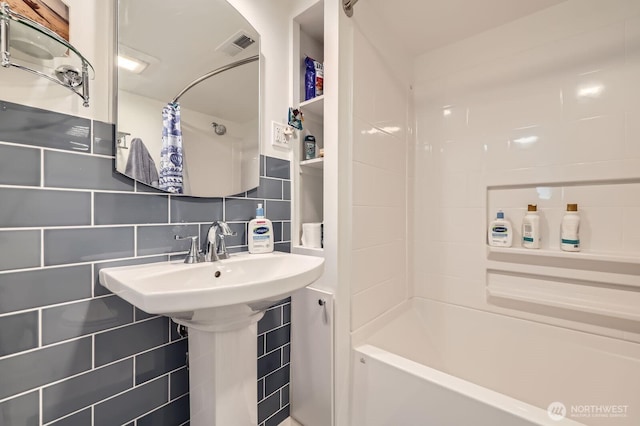 12019B 25th Ave NE, Seattle, WA 98125 - bathroom featuring tile walls, shower / bathtub combination with curtain, and tasteful backsplash
