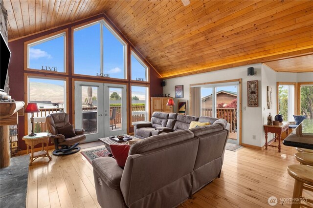 418 Summer Pl SW, Mattawa, WA 99349 - living room with wooden ceiling, french doors, high vaulted ceiling, baseboards, and hardwood / wood-style floors