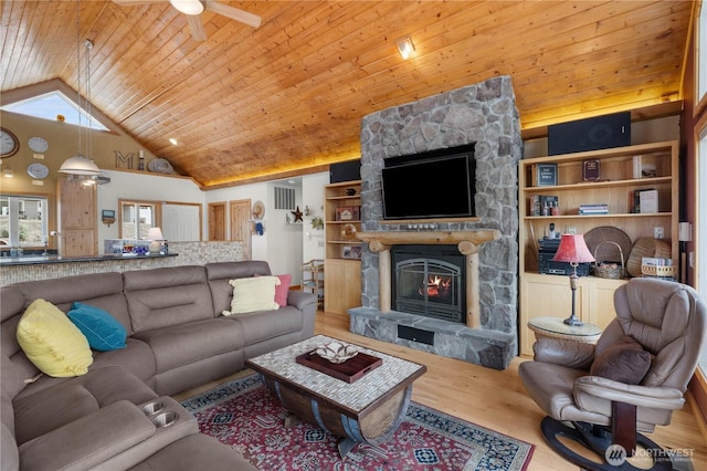 418 Summer Pl SW, Mattawa, WA 99349 - living room with high vaulted ceiling, wood ceiling, wood finished floors, a stone fireplace, and a ceiling fan