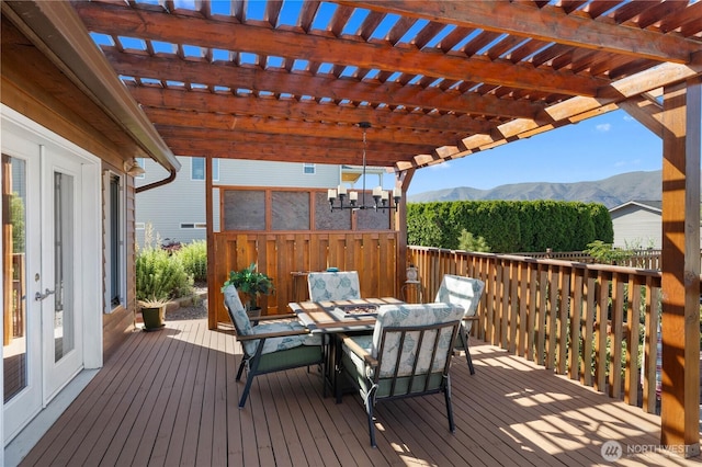418 Summer Pl SW, Mattawa, WA 99349 - wooden terrace featuring a mountain view, french doors, outdoor dining space, and a pergola