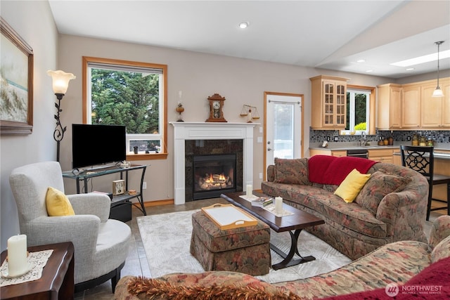252 Mariners Dr, Sequim, WA 98382 - living area with vaulted ceiling, a premium fireplace, and recessed lighting