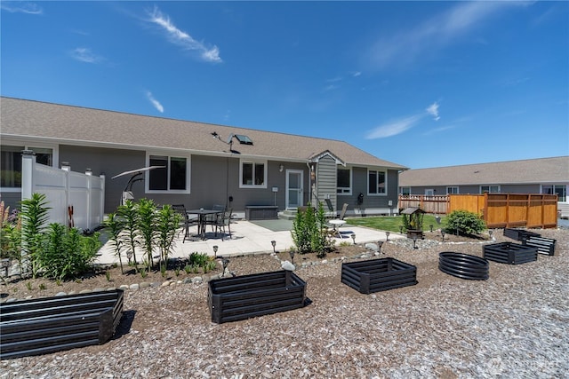 252 Mariners Dr, Sequim, WA 98382 - rear view of property featuring a garden and a patio area