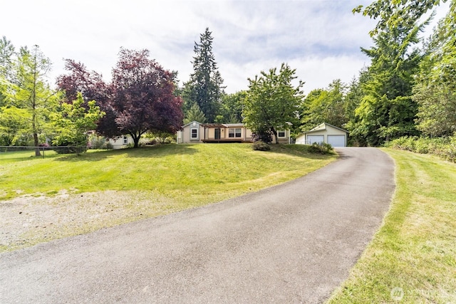 824 Cherub Pl E, Port Orchard, WA 98366 - view of front facade with a detached garage, an outdoor structure, and a front lawn