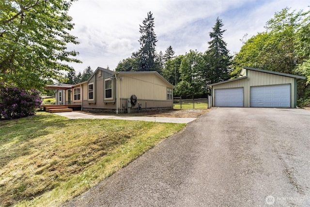 824 Cherub Pl E, Port Orchard, WA 98366 - view of side of home featuring a detached garage and an outbuilding