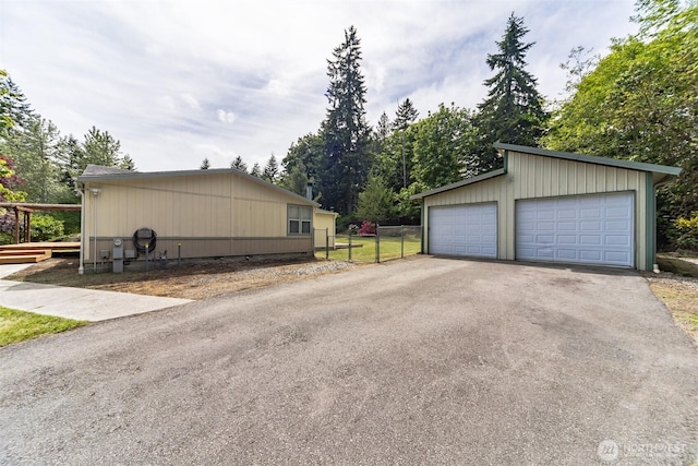824 Cherub Pl E, Port Orchard, WA 98366 - view of side of home featuring a detached garage and an outbuilding
