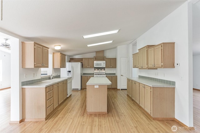 824 Cherub Pl E, Port Orchard, WA 98366 - kitchen featuring white appliances, lofted ceiling, a kitchen island, light countertops, and light wood-style flooring