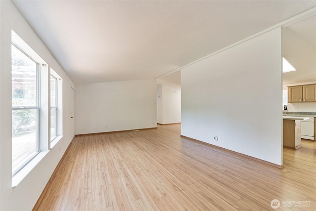 824 Cherub Pl E, Port Orchard, WA 98366 - unfurnished living room with light wood-type flooring and baseboards
