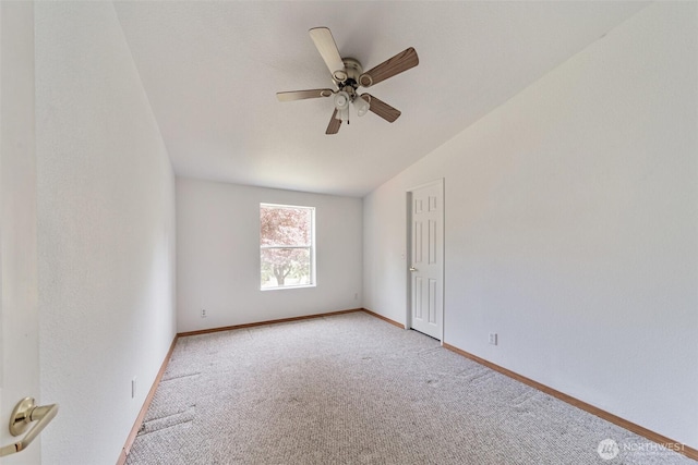 824 Cherub Pl E, Port Orchard, WA 98366 - unfurnished room with light colored carpet, vaulted ceiling, a ceiling fan, and baseboards