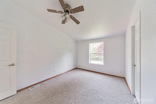 824 Cherub Pl E, Port Orchard, WA 98366 - unfurnished bedroom with light colored carpet, baseboards, and a ceiling fan