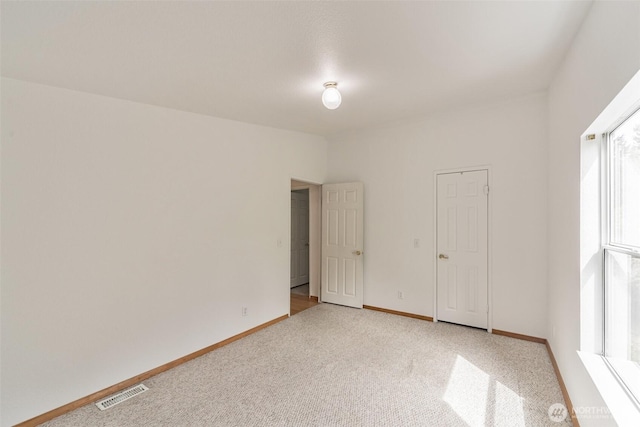 824 Cherub Pl E, Port Orchard, WA 98366 - unfurnished bedroom featuring light carpet and baseboards