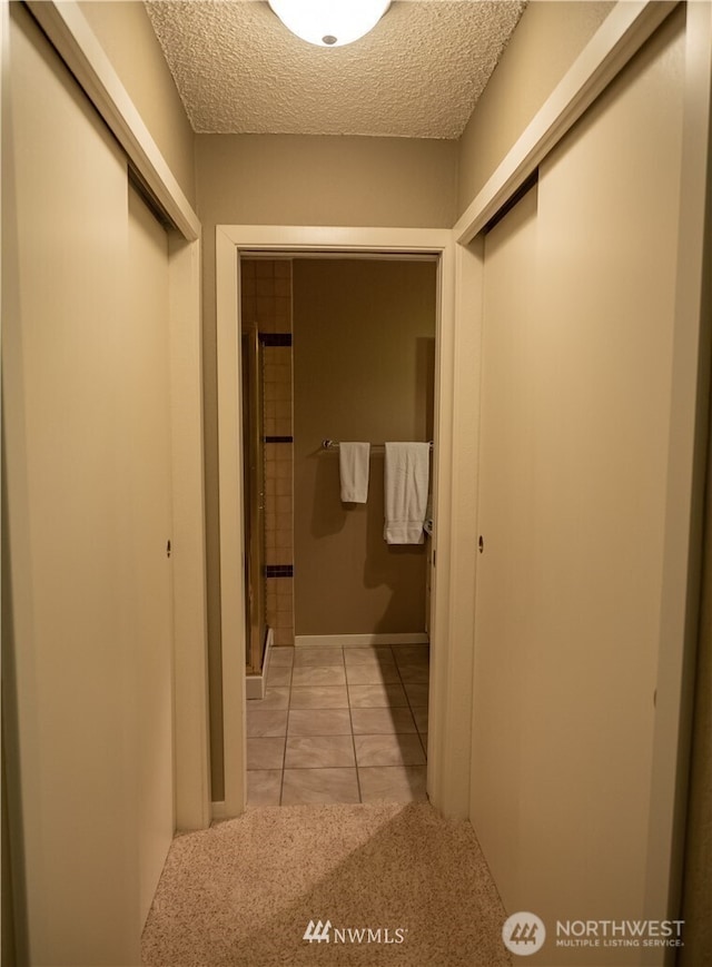 12840 SE 40th Ct Unit B12, Bellevue, WA 98006 - corridor featuring a textured ceiling