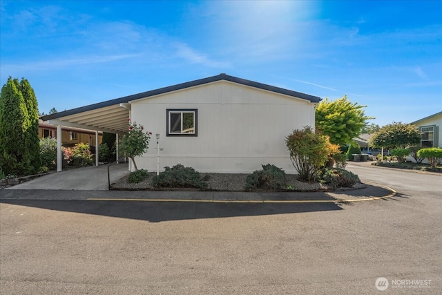 369 Gun Club Rd Unit 117, Woodland, WA 98674 - view of side of property featuring an attached carport