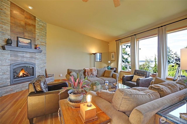 1351 Crestview Dr, Camano Island, WA 98282 - living area featuring lofted ceiling, wood finished floors, and a fireplace