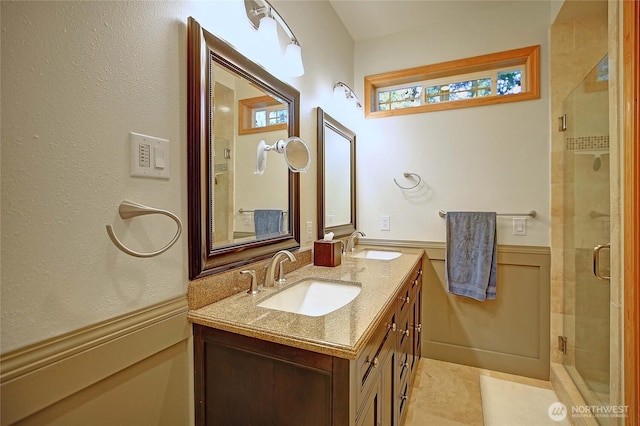 1351 Crestview Dr, Camano Island, WA 98282 - full bathroom with double vanity, a wainscoted wall, and a stall shower