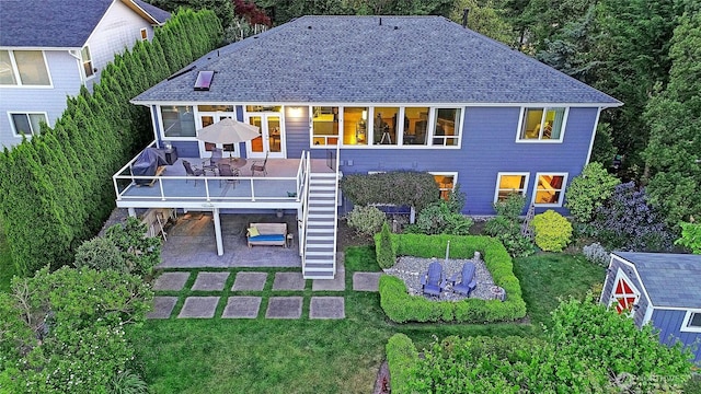 1351 Crestview Dr, Camano Island, WA 98282 - rear view of house featuring a carport, stairs, a patio, a deck, and a shingled roof