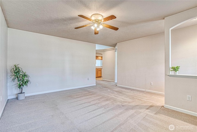 1718 6th St SE, East Wenatchee, WA 98802 - carpeted spare room with ceiling fan, a textured ceiling, and baseboards