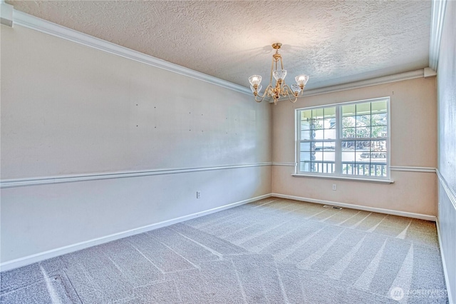 1718 6th St SE, East Wenatchee, WA 98802 - carpeted empty room featuring a chandelier, crown molding, baseboards, and a textured ceiling