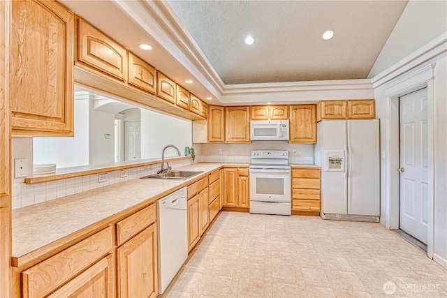 1718 6th St SE, East Wenatchee, WA 98802 - kitchen featuring white appliances, a sink, light countertops, arched walkways, and recessed lighting