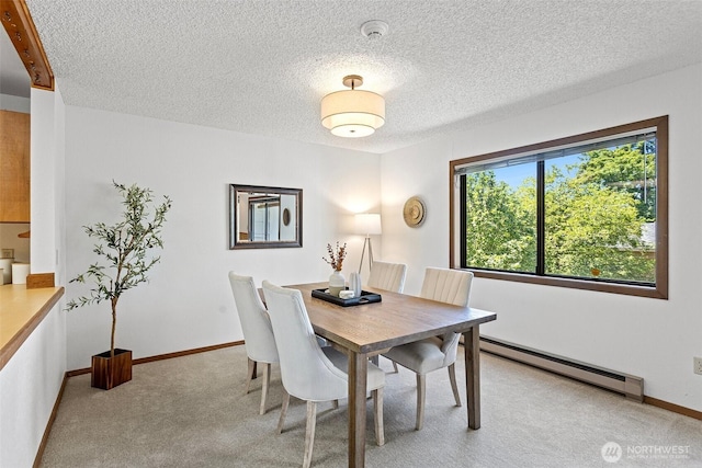 12840 SE 40th Ct Unit A4, Bellevue, WA 98006 - dining space with a baseboard heating unit, light carpet, a textured ceiling, and baseboards