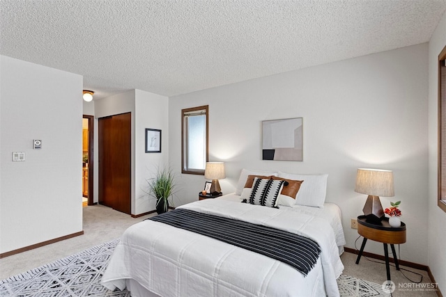 12840 SE 40th Ct Unit A4, Bellevue, WA 98006 - bedroom featuring light colored carpet, baseboards, a textured ceiling, and a closet