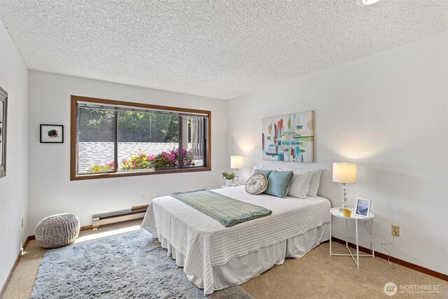 12840 SE 40th Ct Unit A4, Bellevue, WA 98006 - bedroom featuring a baseboard heating unit, carpet floors, a textured ceiling, and baseboards