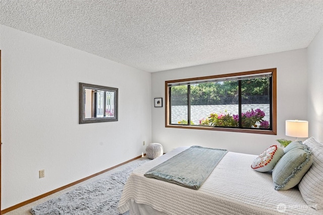 12840 SE 40th Ct Unit A4, Bellevue, WA 98006 - bedroom featuring carpet, a textured ceiling, and baseboards