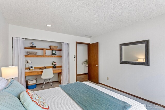 12840 SE 40th Ct Unit A4, Bellevue, WA 98006 - bedroom featuring a textured ceiling, baseboards, and recessed lighting