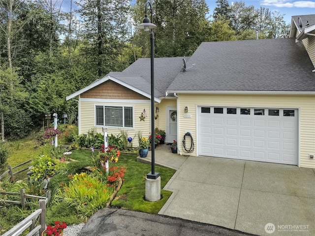 6511 127th Street Ct E Unit 19, Puyallup, WA 98373 - view of front of house with driveway, a shingled roof, and a garage