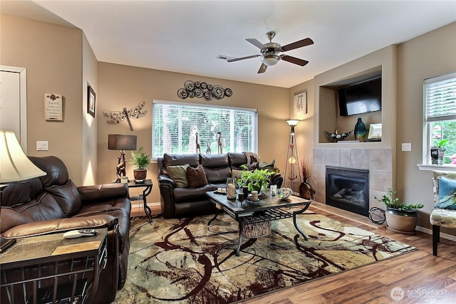 6511 127th Street Ct E Unit 19, Puyallup, WA 98373 - living area featuring ceiling fan, wood finished floors, a fireplace, and baseboards