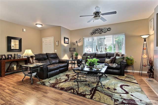 6511 127th Street Ct E Unit 19, Puyallup, WA 98373 - living area featuring wood finished floors, a ceiling fan, and baseboards