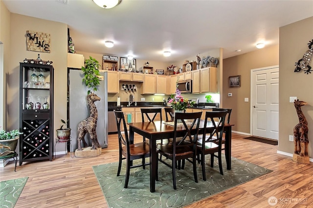6511 127th Street Ct E Unit 19, Puyallup, WA 98373 - dining space with light wood finished floors and baseboards