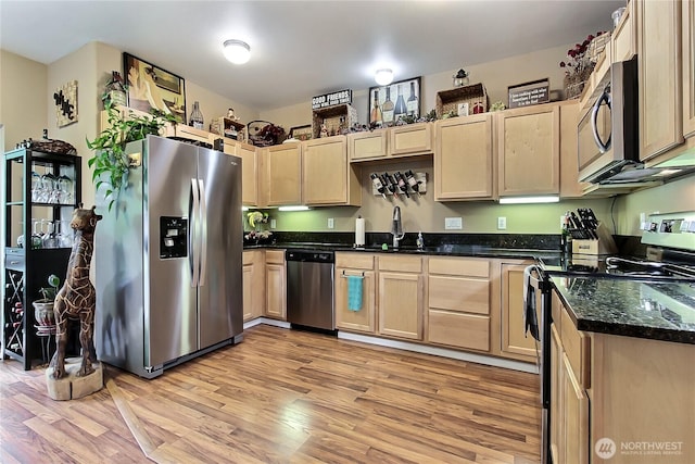 6511 127th Street Ct E Unit 19, Puyallup, WA 98373 - kitchen featuring appliances with stainless steel finishes, light brown cabinetry, a sink, light wood-type flooring, and dark stone counters