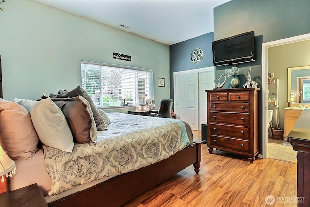 6511 127th Street Ct E Unit 19, Puyallup, WA 98373 - bedroom featuring light wood-style flooring, ensuite bath, and a closet