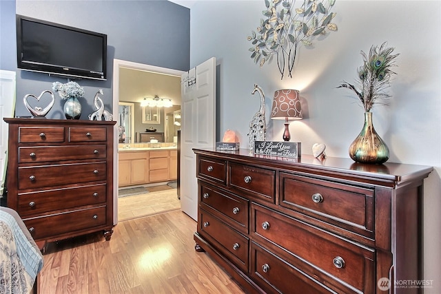 6511 127th Street Ct E Unit 19, Puyallup, WA 98373 - bedroom with light wood-type flooring and connected bathroom
