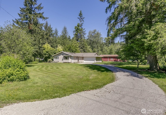 21709 Jordan Rd, Arlington, WA 98223 - single story home with an attached garage, dirt driveway, and a front lawn