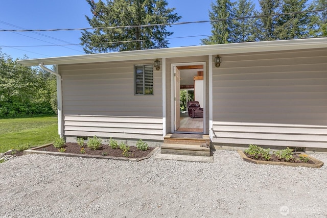 21709 Jordan Rd, Arlington, WA 98223 - view of exterior entry with a yard