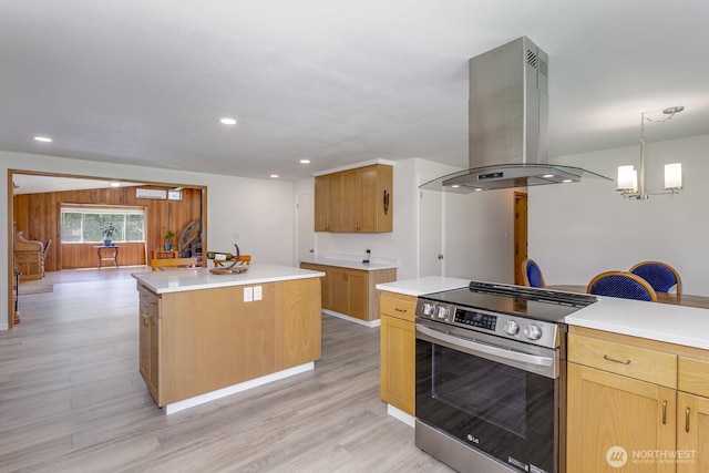 21709 Jordan Rd, Arlington, WA 98223 - kitchen featuring island range hood, stainless steel electric stove, a center island, a chandelier, and light wood-style flooring