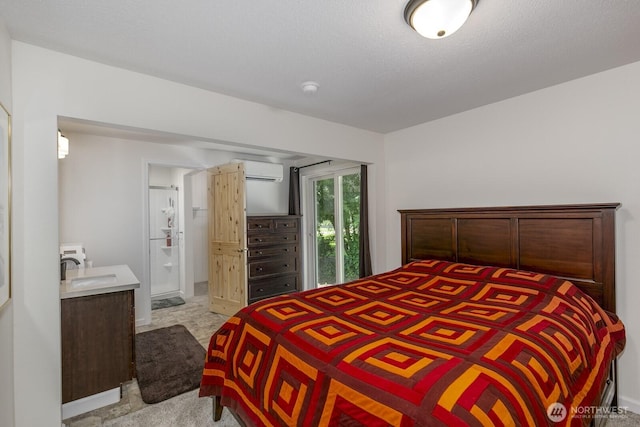 21709 Jordan Rd, Arlington, WA 98223 - bedroom featuring a wall unit AC, carpet, a sink, and connected bathroom