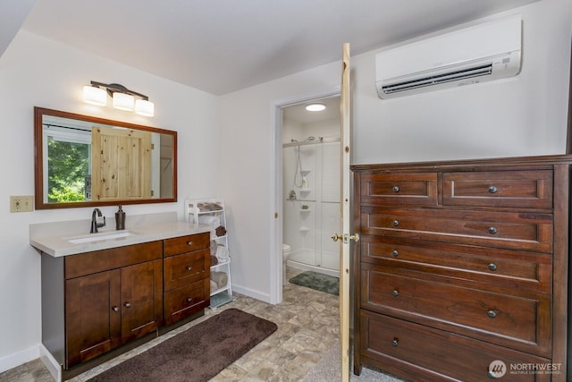 21709 Jordan Rd, Arlington, WA 98223 - full bath featuring a wall mounted AC, vanity, baseboards, a shower stall, and toilet