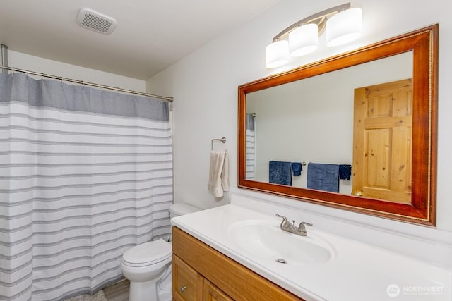21709 Jordan Rd, Arlington, WA 98223 - bathroom with toilet, vanity, and curtained shower
