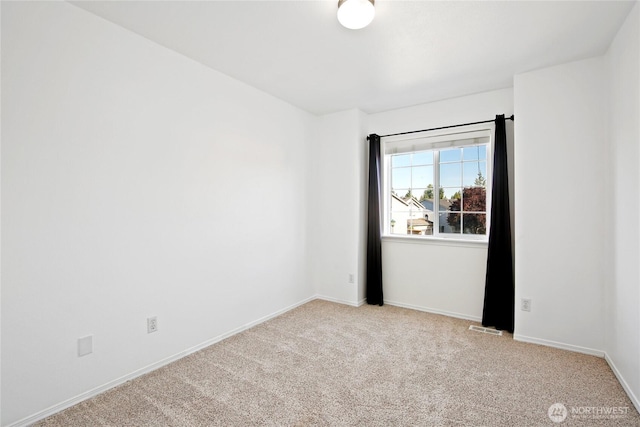 8906 161st St E, Puyallup, WA 98375 - carpeted spare room featuring baseboards