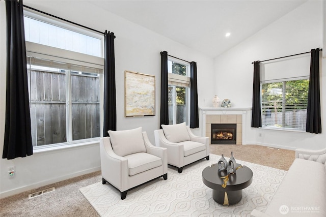 8906 161st St E, Puyallup, WA 98375 - carpeted living room featuring lofted ceiling, healthy amount of natural light, a fireplace, baseboards, and recessed lighting