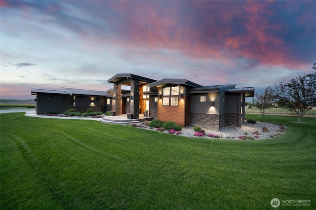126 Red Hawk Rd, Walla Walla, WA 99362 - contemporary home with stone siding, a front yard, and stucco siding