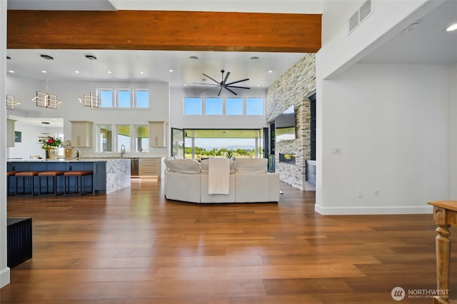 126 Red Hawk Rd, Walla Walla, WA 99362 - living room featuring ceiling fan, a stone fireplace, dark wood-style floors, recessed lighting, and a high ceiling