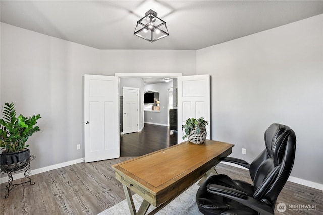 10713 Palisades St SE, Yelm, WA 98597 - office space featuring arched walkways, wood finished floors, and baseboards