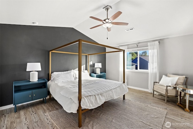 10713 Palisades St SE, Yelm, WA 98597 - bedroom featuring wood finished floors, vaulted ceiling, a ceiling fan, and baseboards